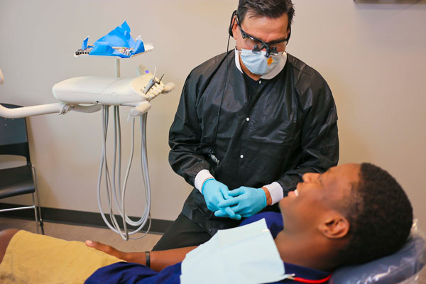 Dr. Jimmy Gardiner with a patient at Singing River Dentistry