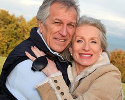  man and woman smiling with dental implants from Singing River Dentistry in FLORENCE, AL