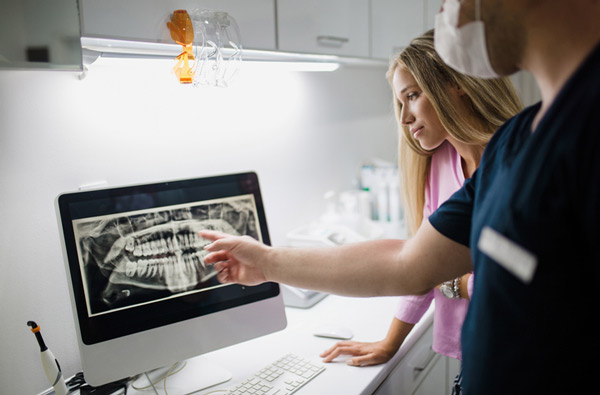 Our dentist reviewing a digital x-ray at Singing River Dentistry in Florence, AL